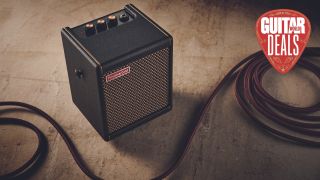 Positive Grid Spark Mini amp on the floor with a guitar cable